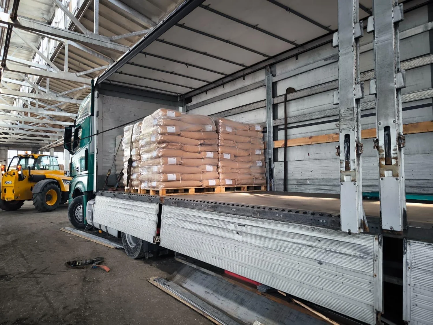 Palletised products being loaded onto a truck